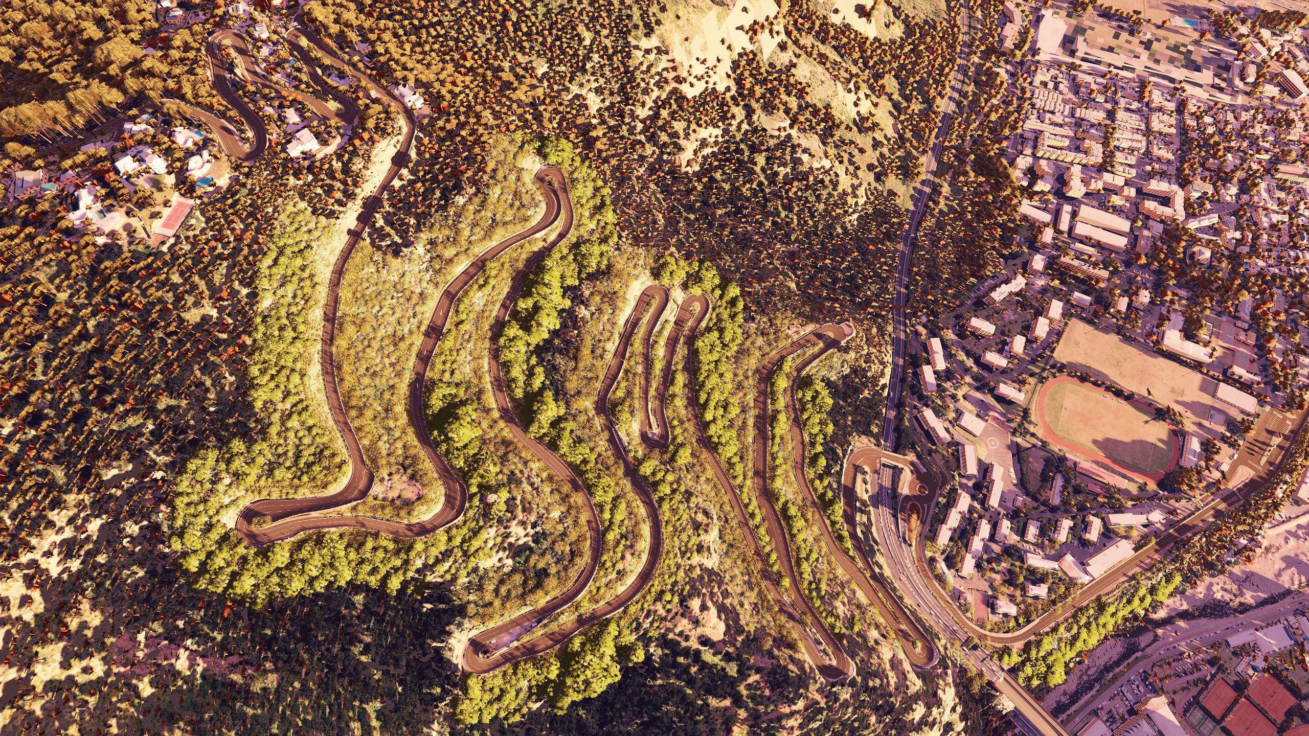 The switchbacks of the Route de la Montagne seen from the sky, above Saint-Denis, in Assetto Corsa
