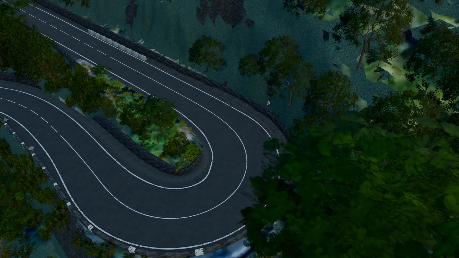 A hairpin seen from above, between low walls and vegetation